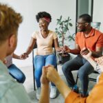 psychotherapy meeting woman support group man therapy psychology hand care closeup holding concept