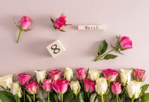 festive background for International Women's Day on eighth of March with delicate androses border.