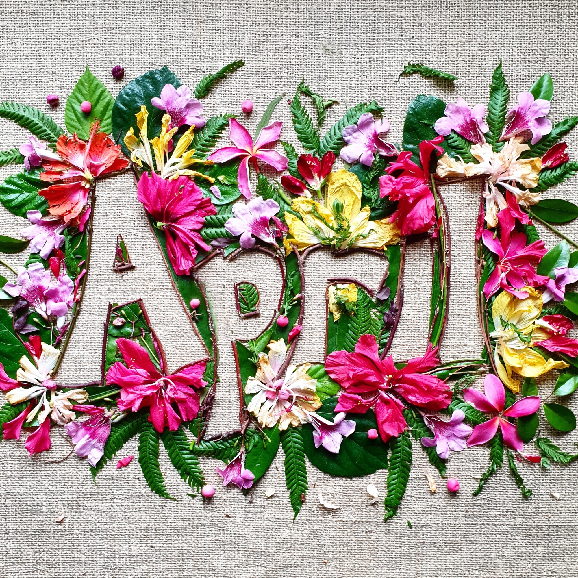 April,creative text made with colourful flowers