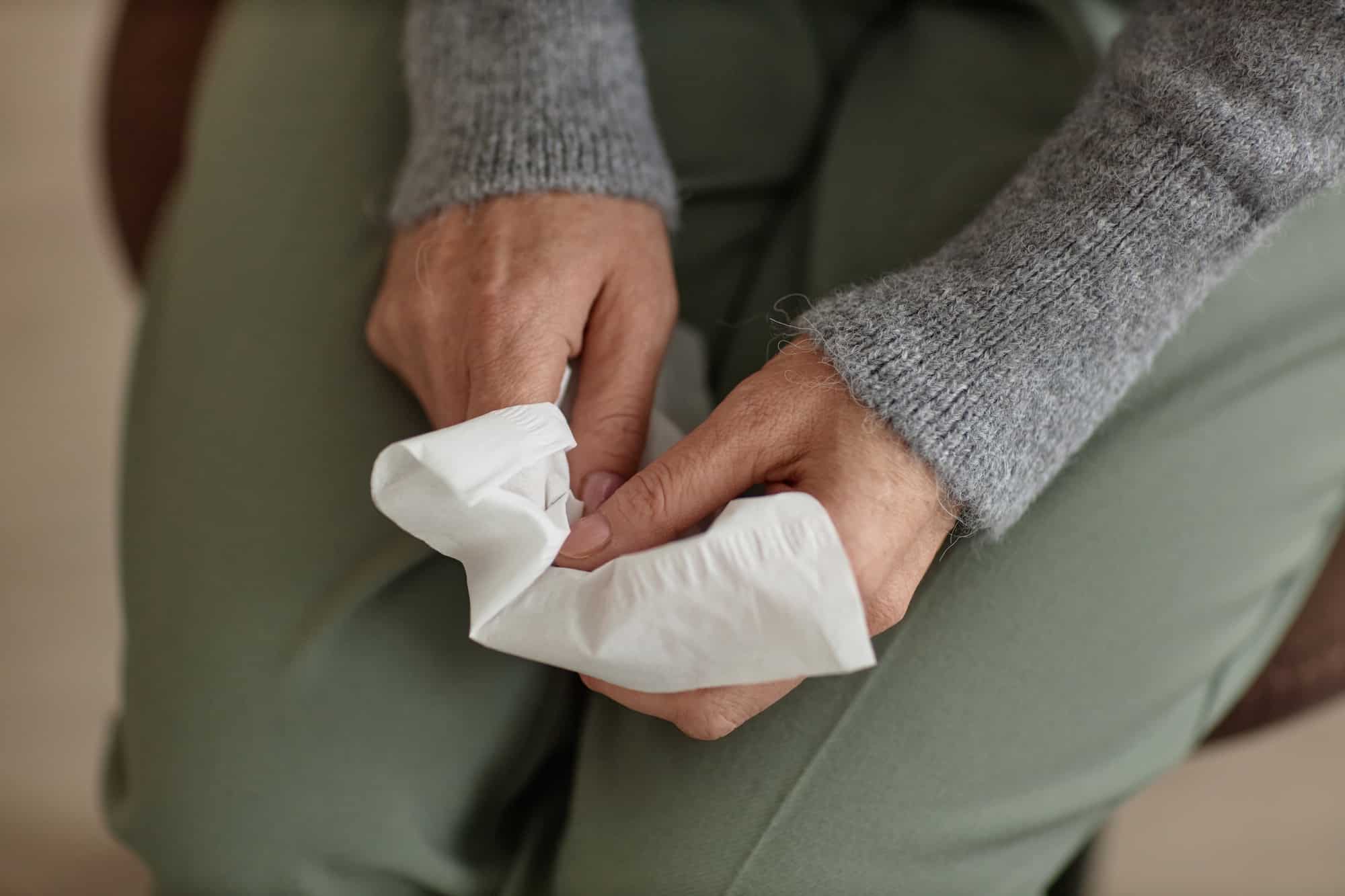 Top View Senior Woman Holding Tissue and Crying